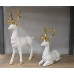 Foto real del set de renos blanco con dorado